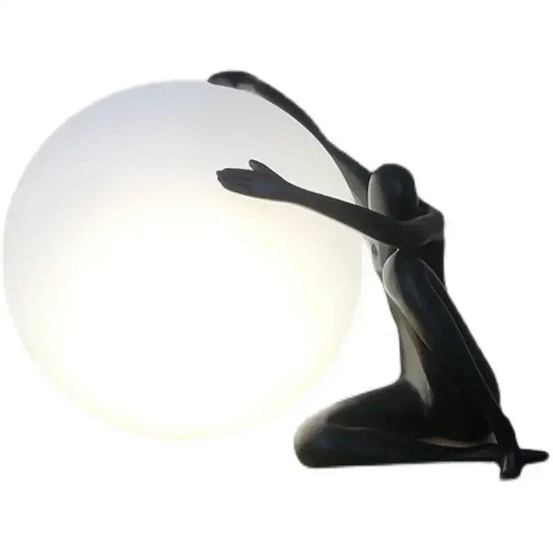 Minimalist black and white decorbites humanoid sculpture led table lamp with a glowing spherical globe for bedroom decor