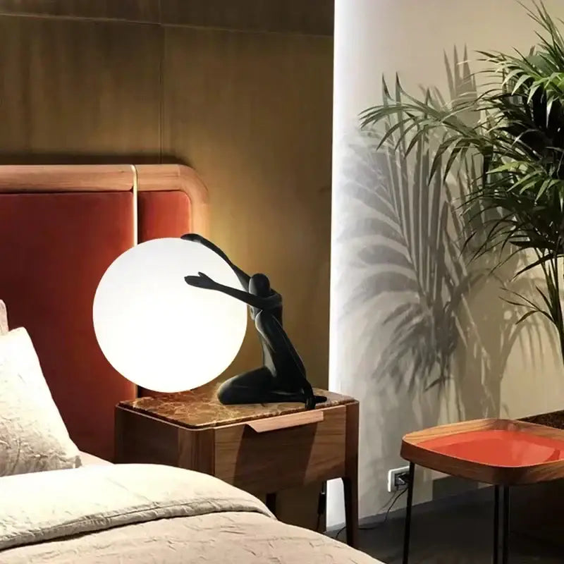 Minimalist black and white humanoid sculpture led table lamp with glowing spherical shade for bedroom decorbits decor
