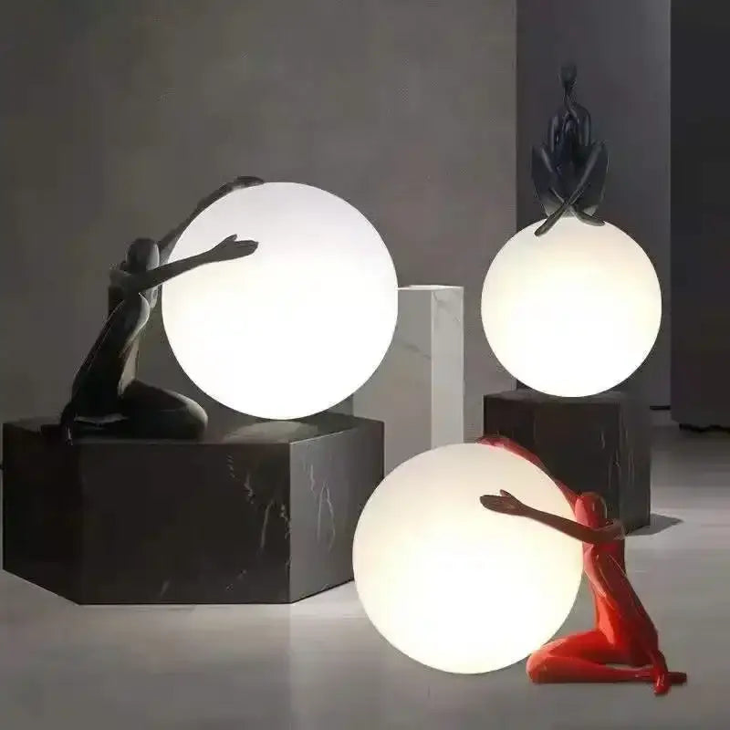 Minimalist black and white humanoid sculpture led table lamp with white spherical lamps and dynamic poses decorbites humanoid sculpture