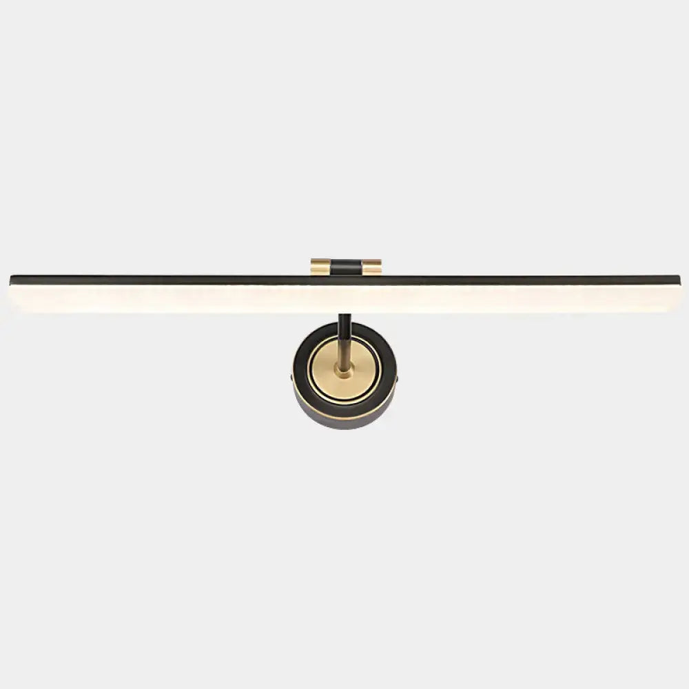 Minimalist black and brass wall mounted vanity light with swing arm and sleek linear design for bathroom use