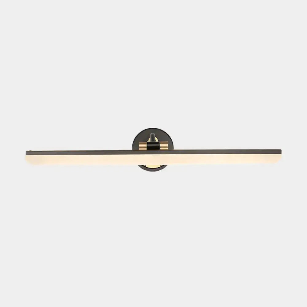 Modern black and brass wall mounted vanity light with a minimalist swing arm design for bathroom use