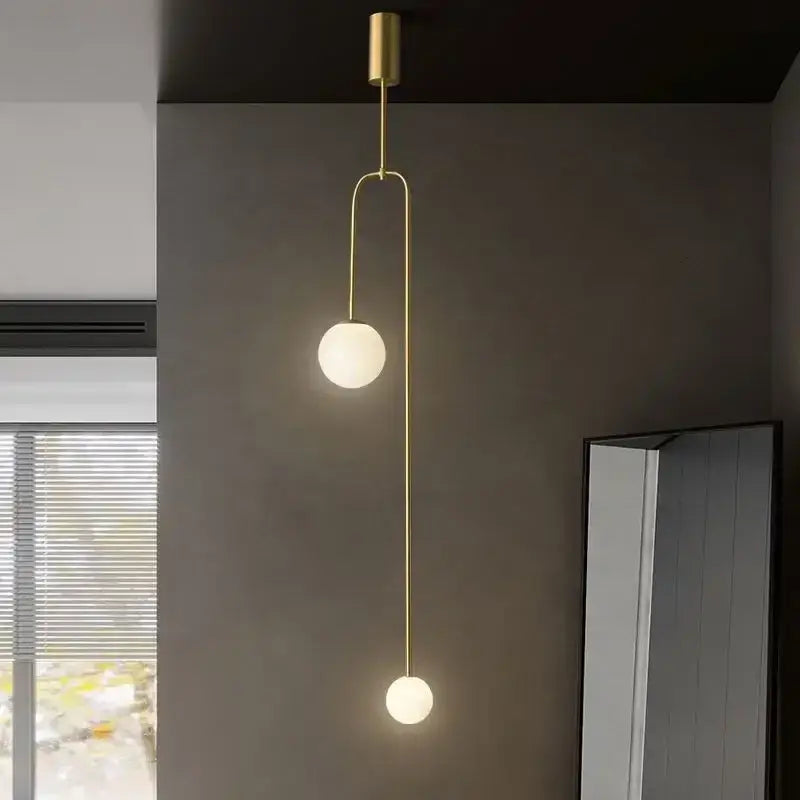 Modern minimalist black bronze glass ball pendant light with curved metal arm and frosted glass bulbs for living room decorbites bronze glass