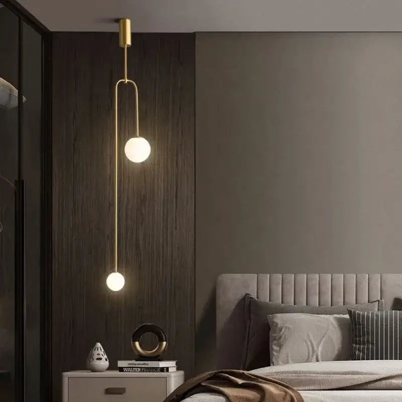 Minimalist black bronze glass ball pendant light with two gold-toned spherical bulbs for living room decorbites bronze glass