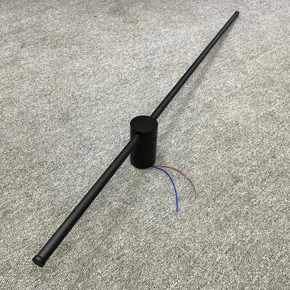 Minimalist black and brushed brass led wall lamp with visible exposed wires and black cylindrical antenna for living room use