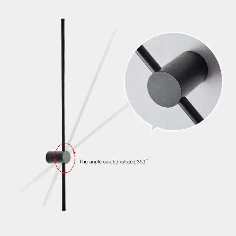Minimalist black matte led wall lamp with brushed brass cylindrical base and adjustable vertical rod for living room use