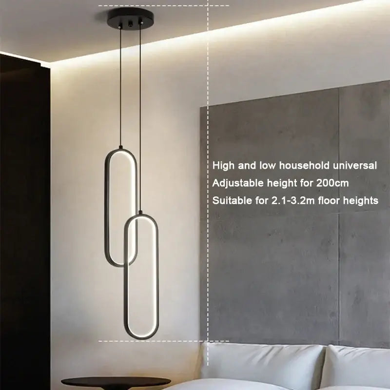 Minimalist black built-in led pendant light with sleek oval frames and adjustable height for dining table lighting