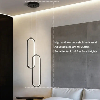 Minimalist black built-in led pendant light with sleek oval frames and adjustable height for dining table lighting