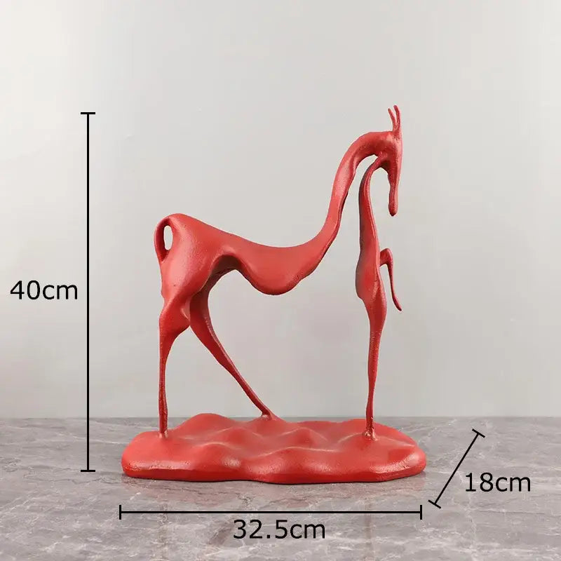 Vibrant red abstract sculpted deer figurine with glossy finish paired with minimalist black decorbites cast iron horse sculpture
