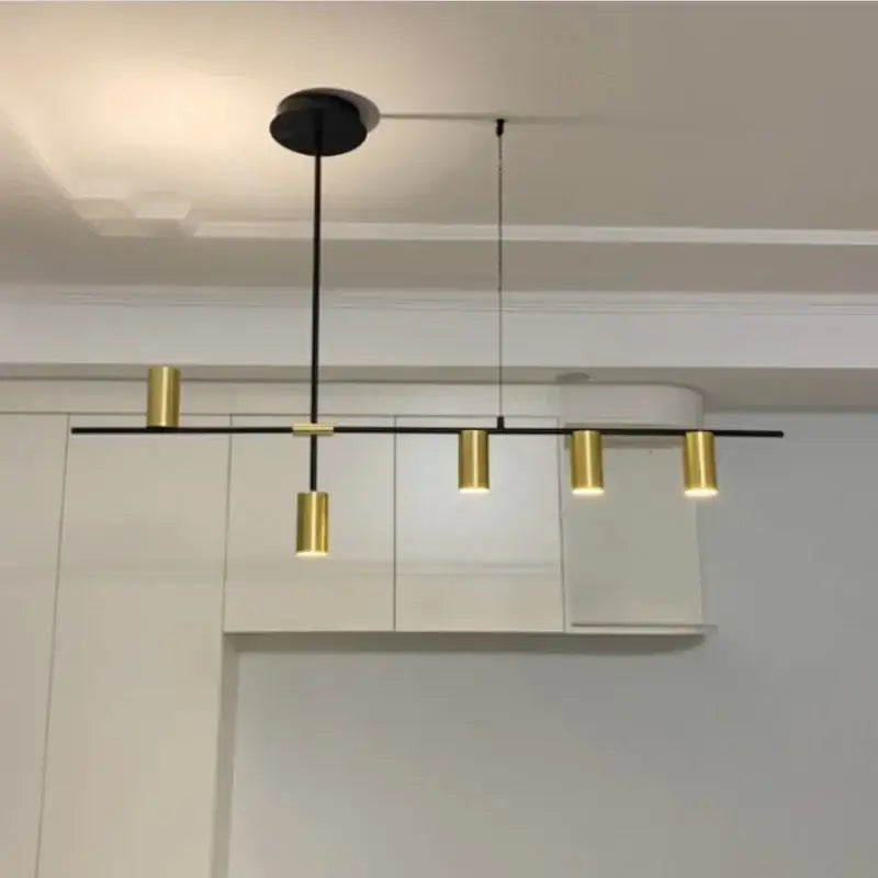 Minimalist black chandelier pendant lights with a sleek black rod and gold fixtures for dining room decorbites pendant lights