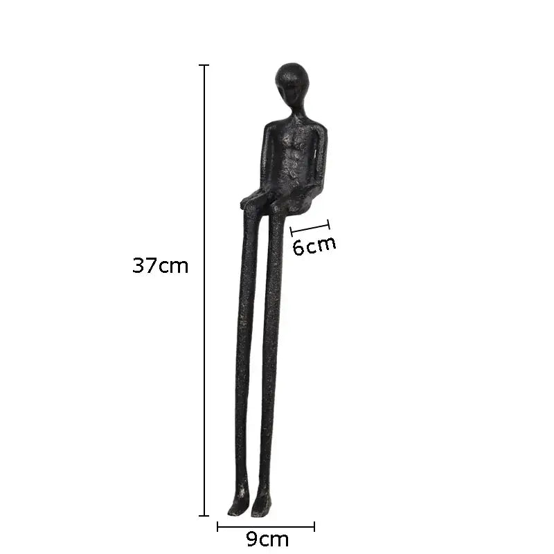 Minimalist black character metal statue with matte finish and elongated limbs for living room desk ornament