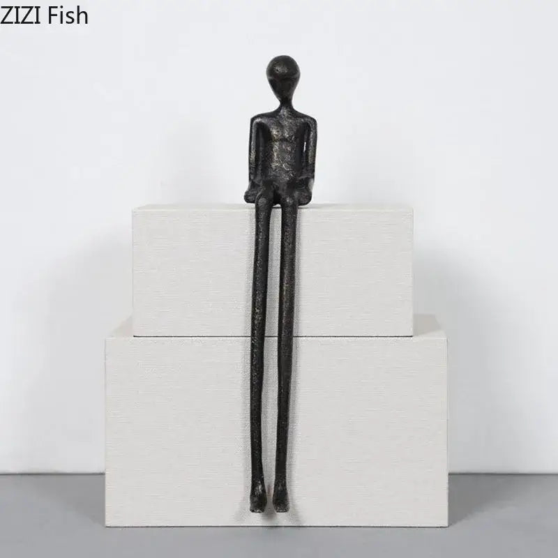 Minimalist black character metal statue with elongated limbs and smooth head as a metal statue desk ornament