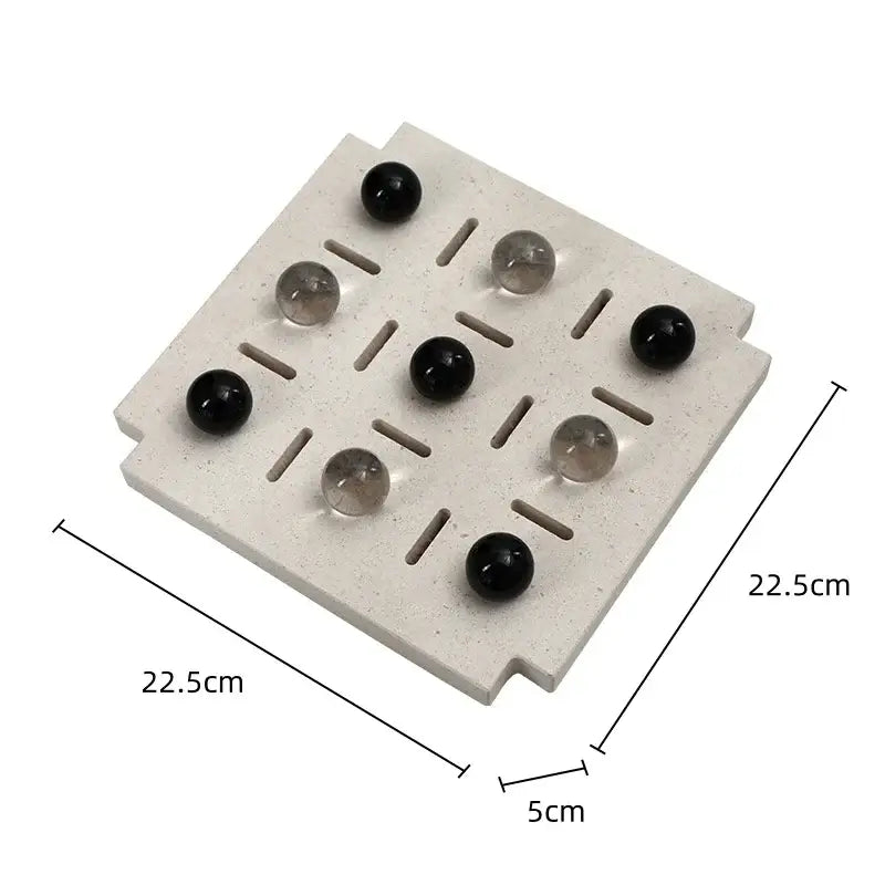 Minimalist black and clear geometric glass bead chess set with a light gray stone board for living room decorbites geometric glass
