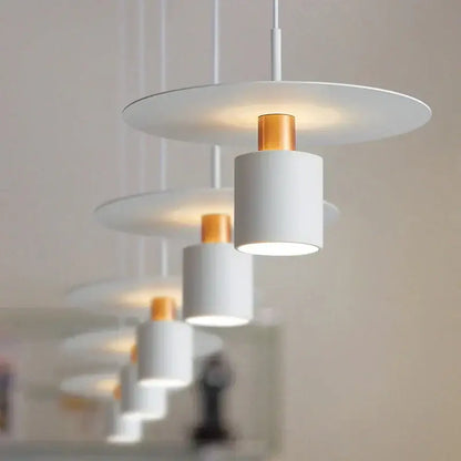 Minimalist black and copper decorbites iron art led chandelier with modern white pendant lights and gold accents cylindrical design