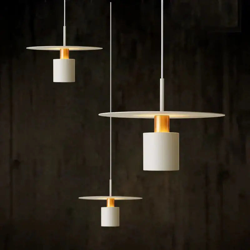 Modern white pendant lights with gold accents and minimalist cylindrical shades in decorbites iron art led chandelier design