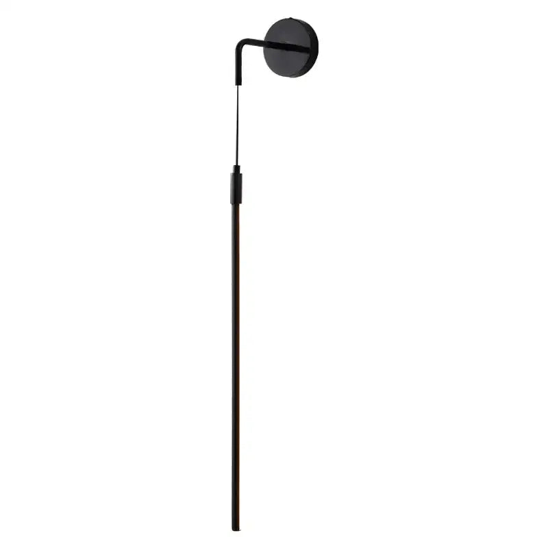 Minimalist black copper wall lamp with a sleek slender pole and circular head ideal for bedroom decorbites copper wall lighting