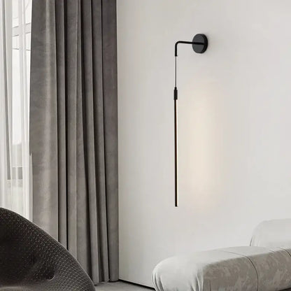 Minimalist black copper wall lamp with sleek slender arm and circular base for modern bedroom decorbites copper wall lamp