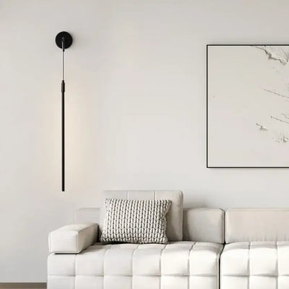 Minimalist black copper wall lamp with sleek vertical rod and circular base for modern bedroom decorbites copper wall light