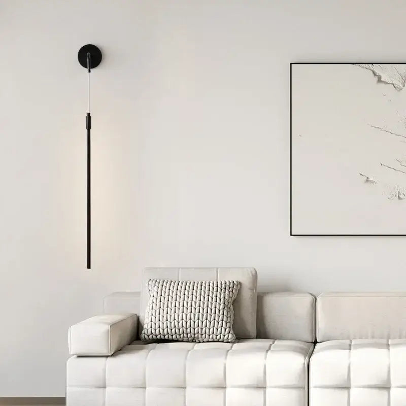 Minimalist black copper wall lamp with sleek vertical rod and circular base for modern bedroom decorbites copper wall light