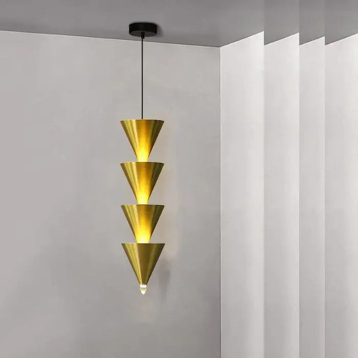 A minimalist cream bedroom chandelier with four stacked golden conical shades and a black ceiling mount by decorbites