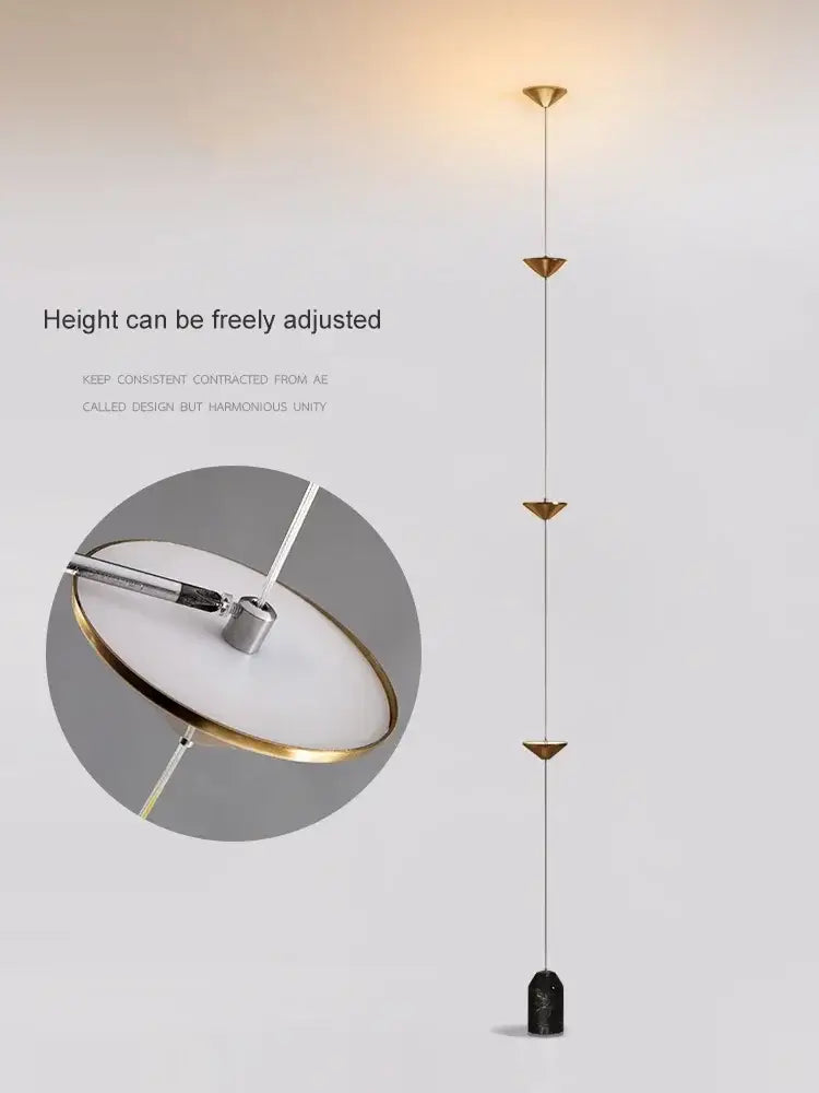 Modern adjustable floor lamp with gold-toned metal frame white circular shade and black marble base decorbites cone design art