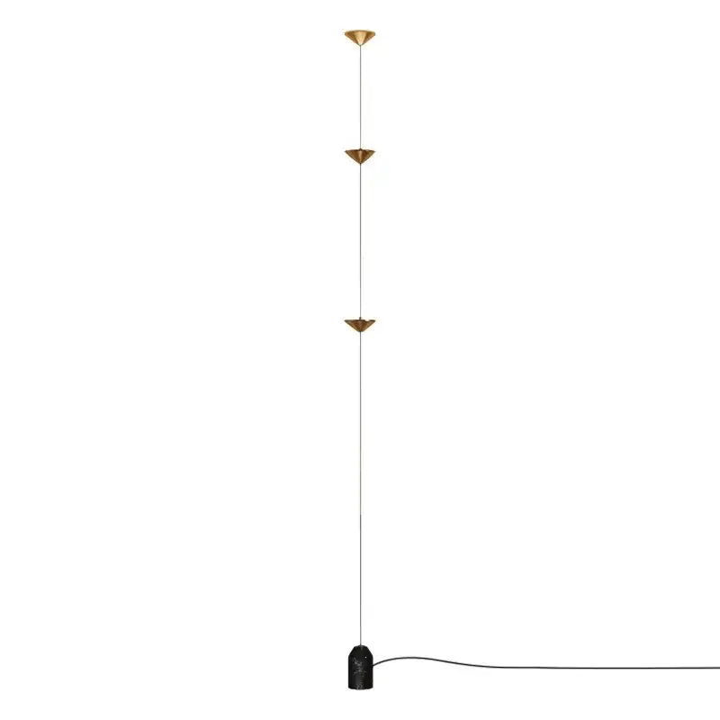 Minimalist gold-toned floor lamp with three conical shades and black marble base featuring decorbites cone design art