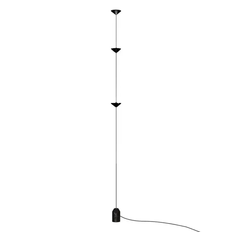 Minimalist black floor lamp with decorbites cone design featuring three triangular shades and cylindrical base for living room