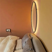 Minimalist black designer ring led wall light with sleek frame and warm glowing illumination for living room decorbites wall light