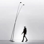 Minimalist black floor lamp with curved LED arms and circular light fixtures for modern living room decorbites black floor lamp