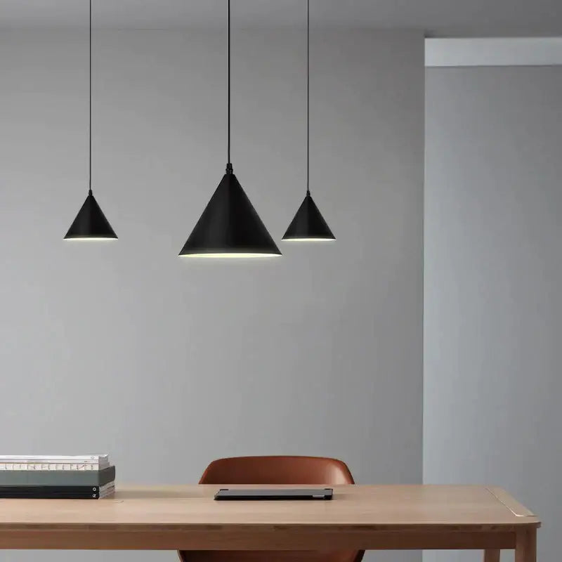 Three black conical matte finish pendant lights with minimalist design decorbites geometric led pendant for living room decor