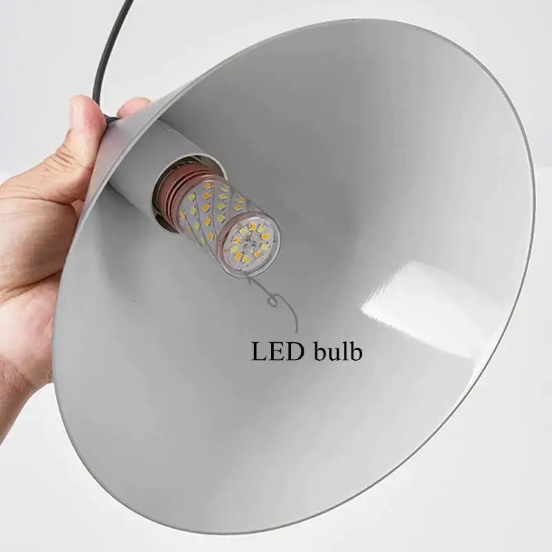 Minimalist black geometric led pendant light with gray conical fixture holding clear led bulb for modern decorbites decor