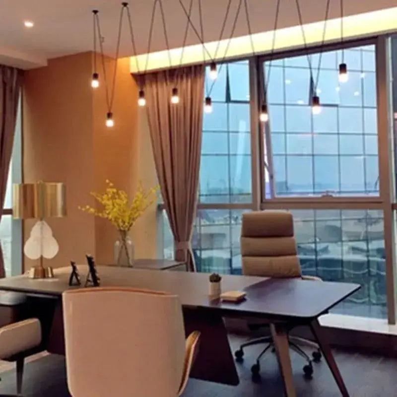 Modern beige office chair with high back and segmented cushioning shown beside minimalist decorbites black geometric pendant lamp for living room decor