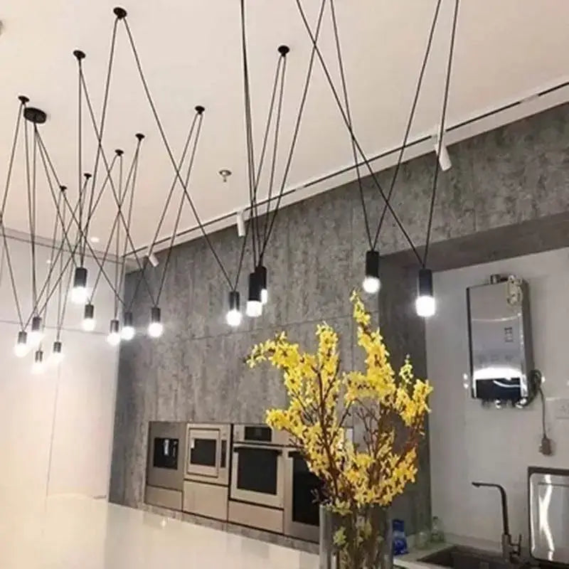 Minimalist black geometric pendant lamp with exposed bulbs in a starburst pattern for living room decorbites black geometric