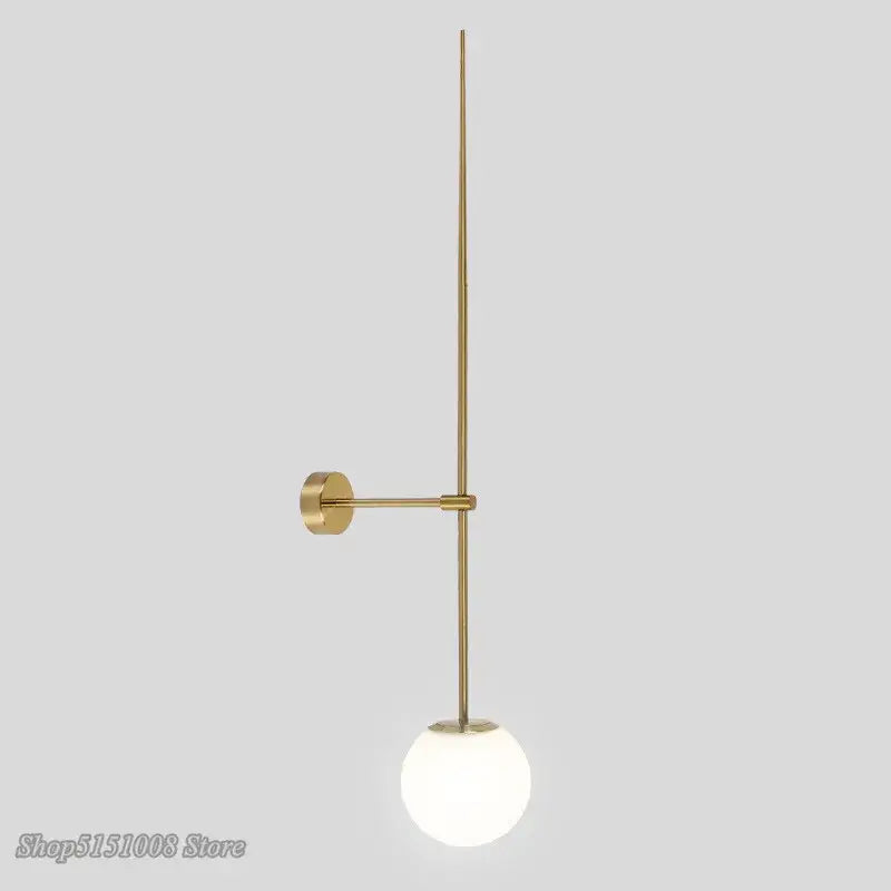 Gold-toned minimalist ball led wall sconce with a slender rod and frosted glass ball shade for bedroom decorbites glass ball