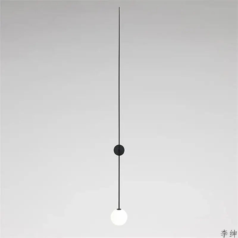 Minimalist black glass ball led wall light with frosted globe and slender cord for modern decorbites glass ball wall light