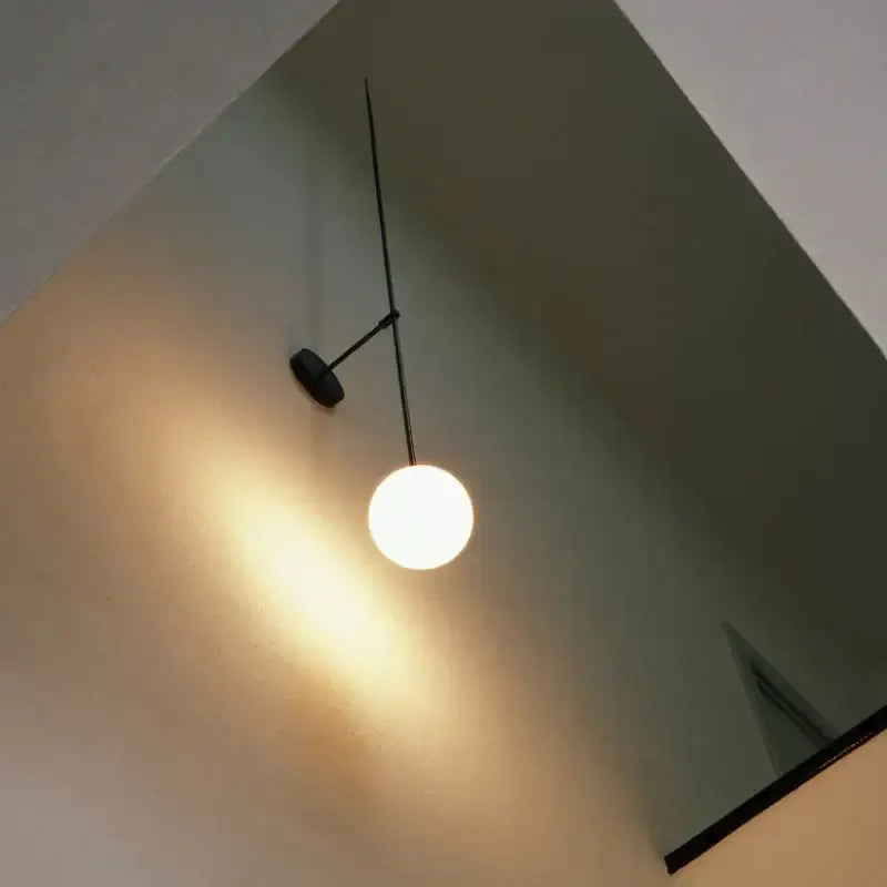 Minimalist black metal wall lights with a spherical frosted glass ball led for modern living room decorbites glass ball