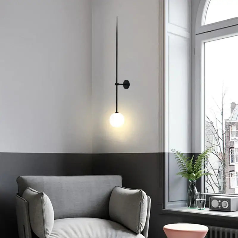 Minimalist black glass ball led wall light with slender rod and frosted glass bulb for living room decorbites wall lights