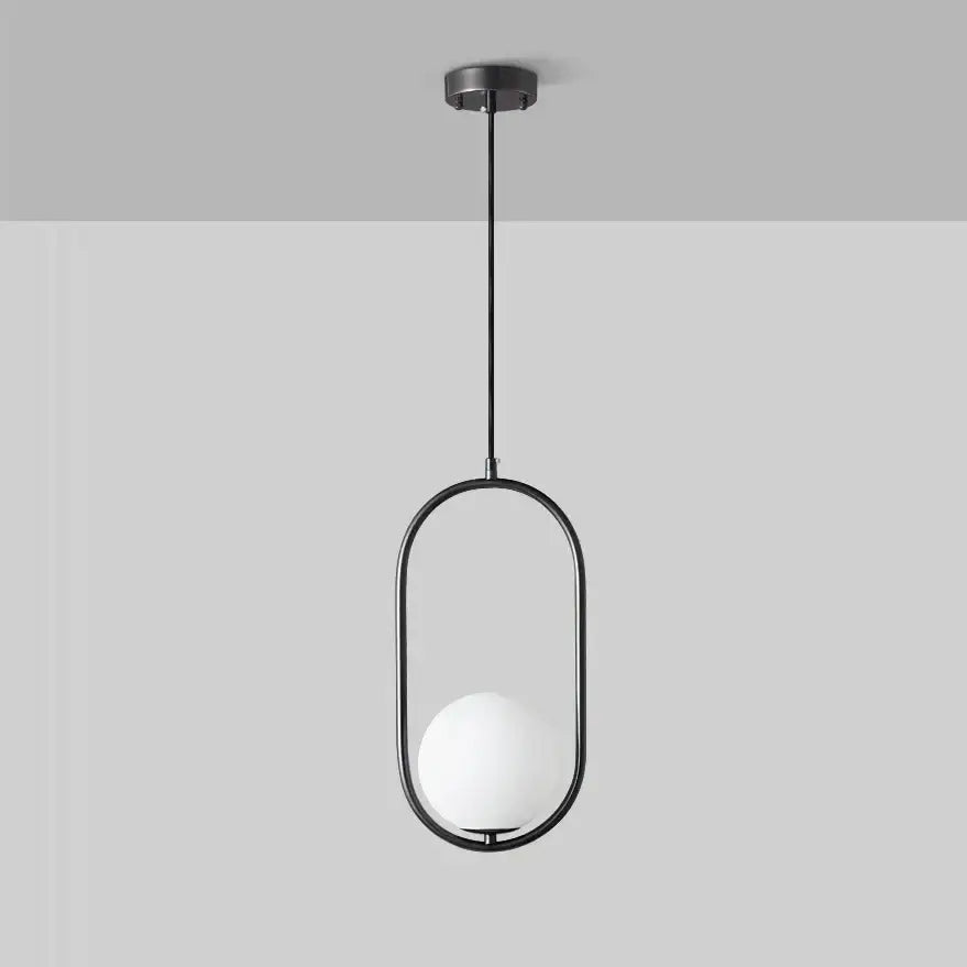 Minimalist black pendant lamp with a sleek oval metal frame and frosted white glass ball for dining room decorbites glass ball