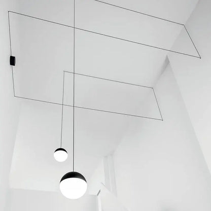 Minimalist black glass ball pendant light with spherical glass shades suspended by thin cables for kitchen decorbites glass ball pendant illumination