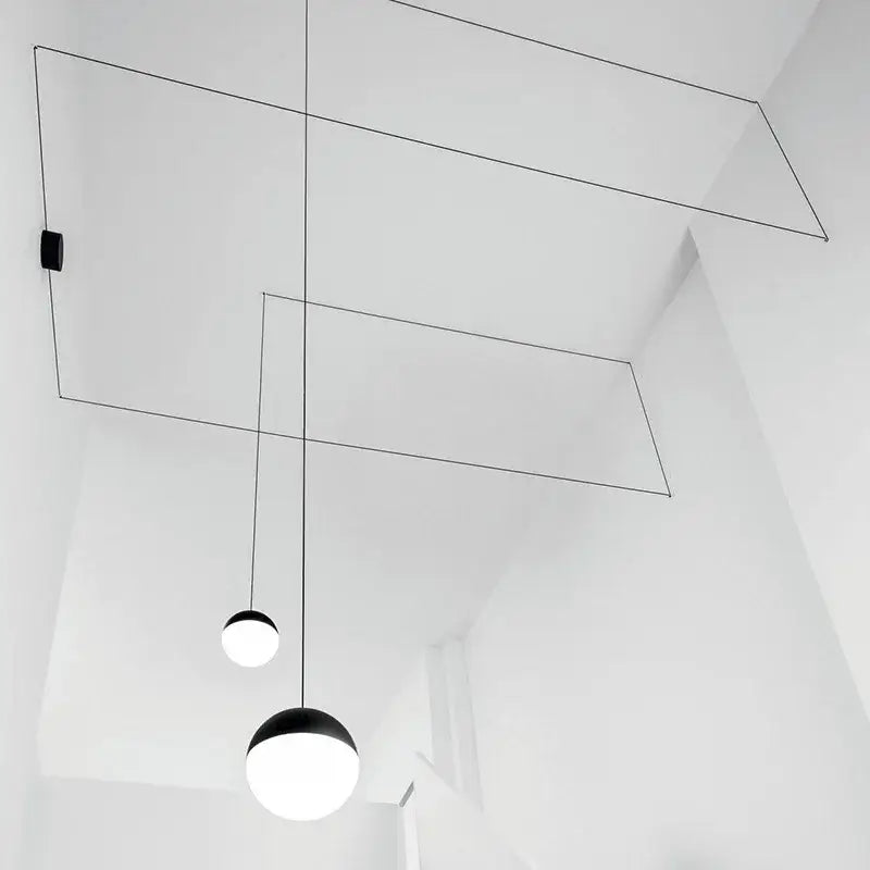 Minimalist black glass ball pendant light with spherical glass shades suspended by thin cables for kitchen decorbites glass ball pendant illumination