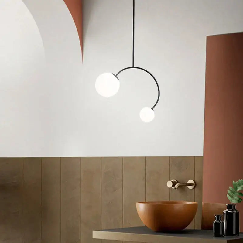 Modern black metal pendant lights with two white glass ball bulbs feature minimalist decorbites glass ball design for dining rooms