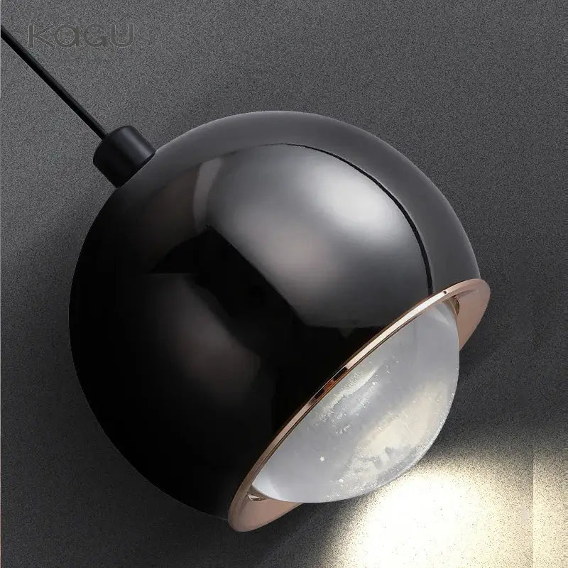 Minimalist black spherical pendant light with rose gold rim and frosted glass diffuser for decorbites gold metal luster