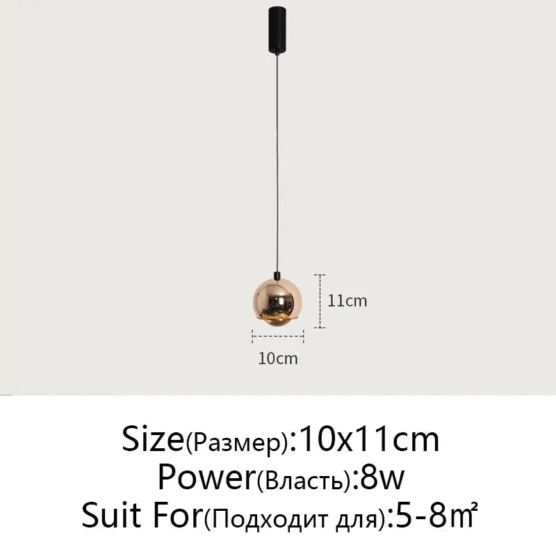Minimalist black glossy pendant light with a sleek spherical copper-toned decorbites gold metal luster for bedroom and kitchen island