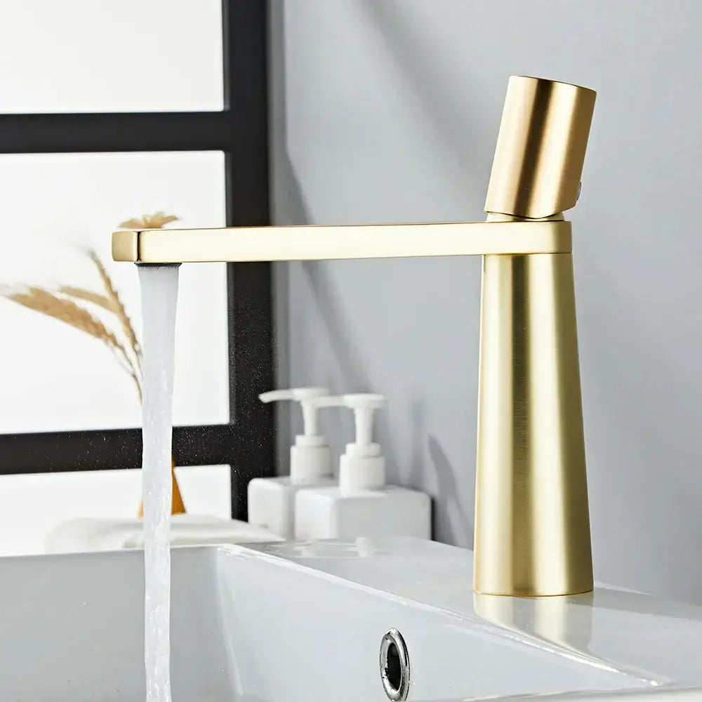 Minimalist black and gold brass bathroom faucet mixer tap with a sleek modern brass bathroom faucet decorbites finish