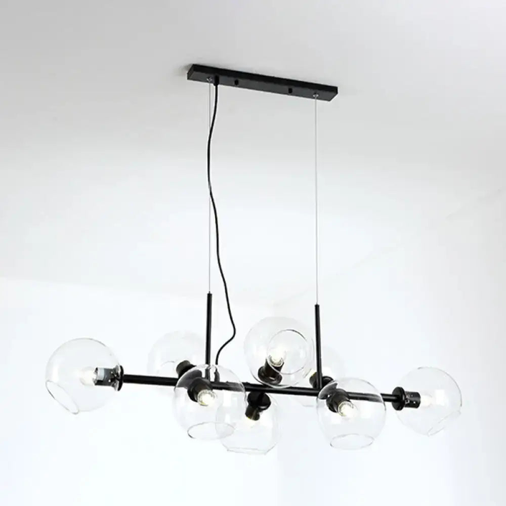 Minimalist black metal chandelier with clear smoke grey glass globe shades for dining room lighting