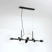 Minimalist black metal chandelier with clear smoke grey glass globe shades for dining room lighting