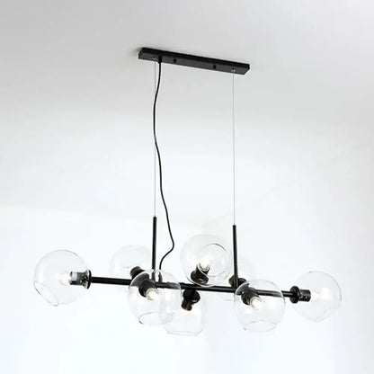 Minimalist black metal chandelier with clear smoke grey glass globe shades for dining room lighting