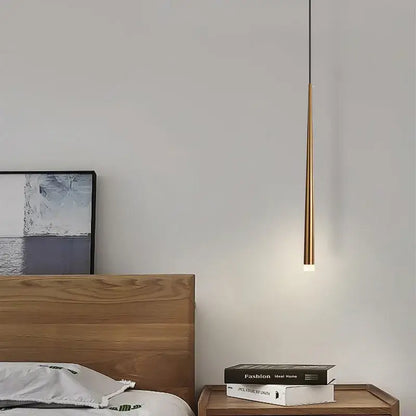 A sleek gold-toned decorbites cone tube pendant light with warm glow for kitchen and dining room decor