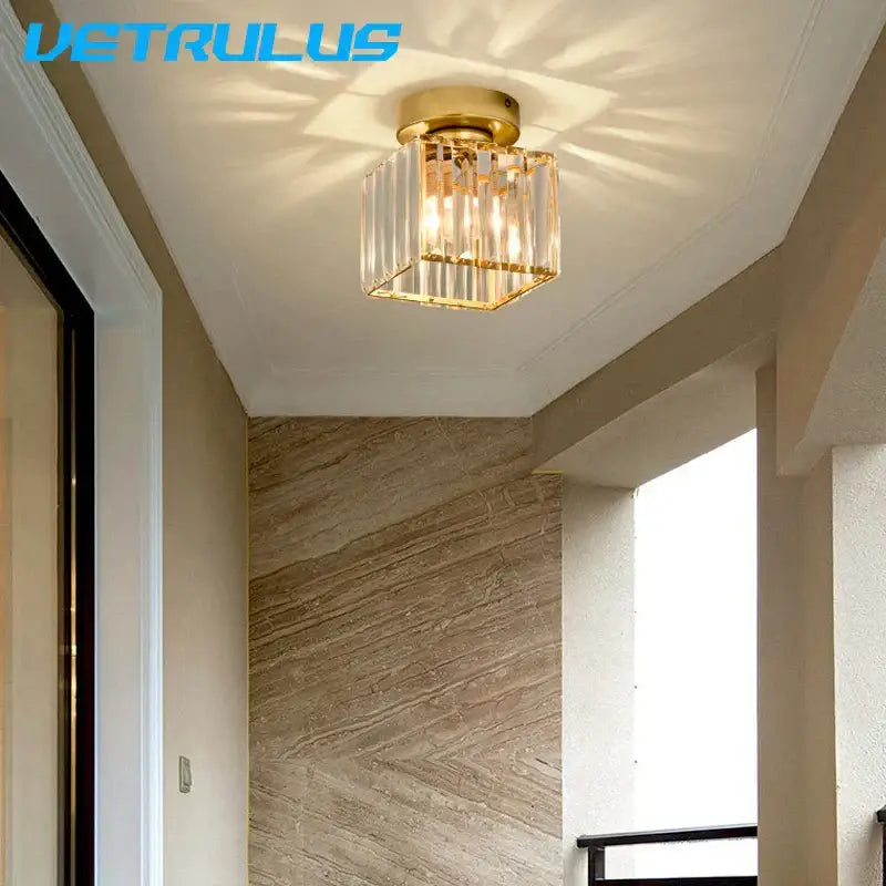 Minimalist black and gold decorbites crystal ceiling chandelier with gold-finished vertical glass prisms and square frame