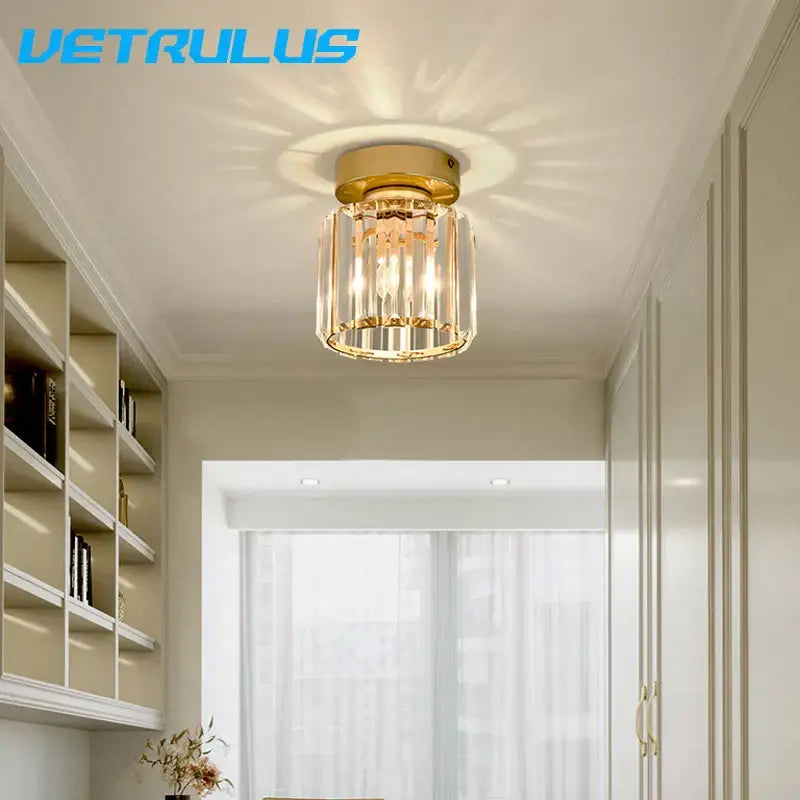 Minimalist black and gold decorbites crystal ceiling chandelier with clear crystal rods and illuminated bulb for corridor light