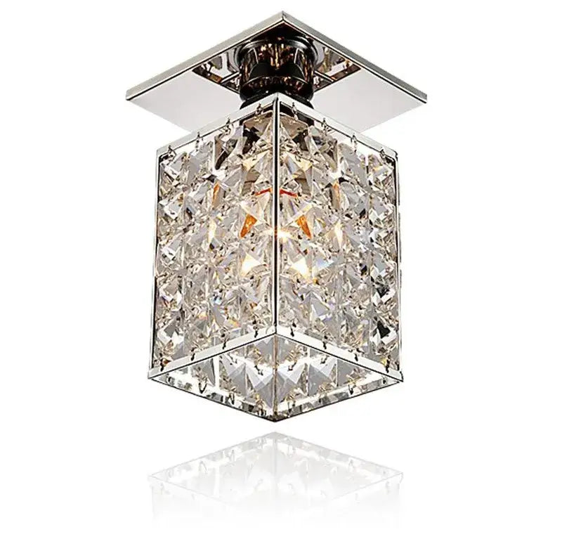 Minimalist black and gold decorbites crystal ceiling chandelier with chrome finish and faceted clear crystals in geometric pattern